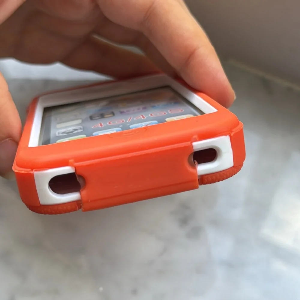 Orange over white defender case for iPhone 4/4s
